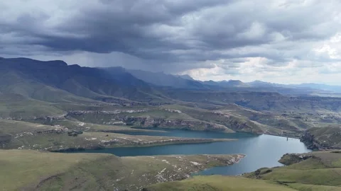 Dramatic Aerial Perspective Of South African Reservoir Under Brewing Storm Stock Footage 332428130