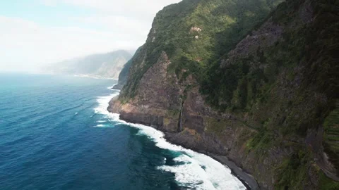 Dramatic aerial perspective of the veu da noiva waterfall cascading down a Stock Footage 321937242