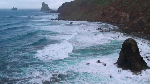 Dramatic aerial perspective of the wild Atlantic ocean shoreline. Powerful Stock Footage 331464175