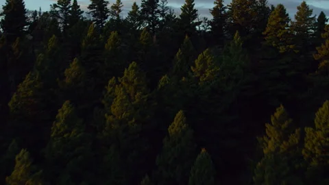 Dramatic aerial reveal of snow capped mountains at dusk Vidéo 266053405