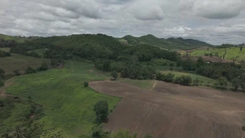 Dramatic Aerial Shot of Multi-Layered Green Hills Fading to Misty Mountains.. Stock Footage 337390884