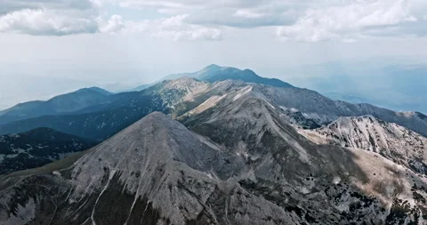 Dramatic aerial shot of rugged mountain range Stock Footage 303302216