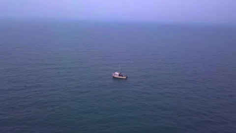 Dramatic Aerial Shot Of Sailboat Alone In The Ocean Видео 204872327