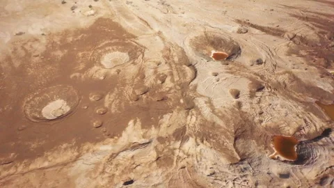 A dramatic aerial shot of sinkholes at the Dead Sea Stock Footage 294261753