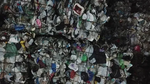 Dramatic aerial showing extent of Plastic scrap recycling piling up on yard - ra 動画素材 84744783