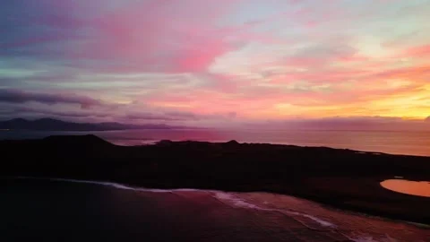 Dramatic aerial sunrise pan clip Lobos island Fuerteventura Stock Footage 176916896