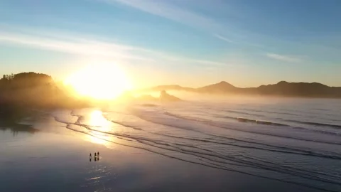 Dramatic Aerial Sunrise Scene At The Beach With People Walking Video stock 168317109