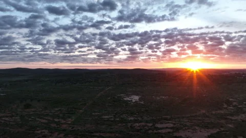 Dramatic aerial sunset over the rugged outback landscape surrounding Broken Video stock 342339093