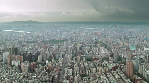 Dramatic aerial time-lapse of tiny traffic in Taipei, Taiwan under stormy sky Stock Footage 57108181