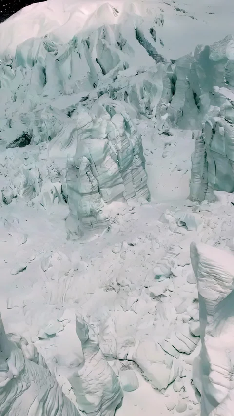 Dramatic aerial vertical clip: Mount Elbrus glacial slopes in golden hour slowmo Stock Footage 305834868