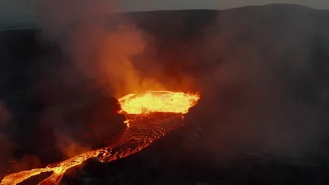 Dramatic Aerial View of Active Volcano Crater Erupting at Night Stock Footage 322179120