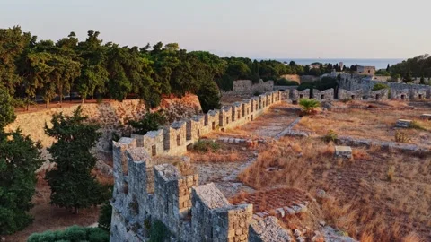 Dramatic aerial view of ancient walls in Rhodes, Greece at sunset Stock Footage 318016928