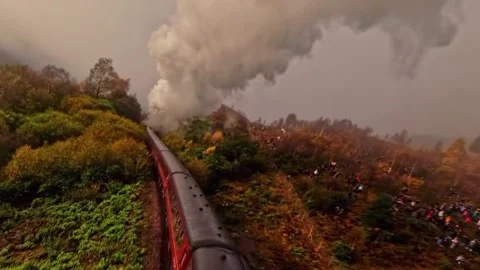 Dramatic aerial view of a classic red steam train 스톡 동영상 328982460