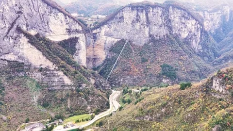 Dramatic Aerial View of Cliff Walkways and Incline Elevator in Mountain Valley Stock Footage 346334378