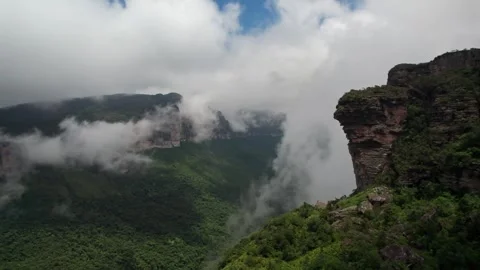 Dramatic Aerial View: Clouds Drift Over Lush Green Mountain Valley Видео 332727053