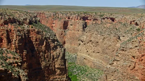 Dramatic aerial view deep inside a steep Canyon near Big Horn Canyon, Montana Stock-Footage 260752601