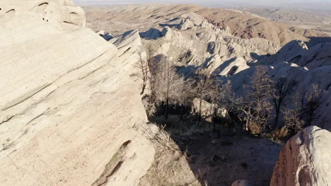 A dramatic aerial view of the Devil's Punchbowl, showcasing the unique and Stock Footage 280131416