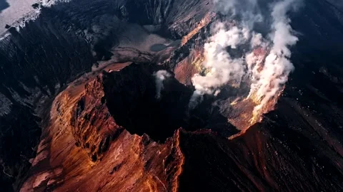 Dramatic Aerial View of Erupting Volcano with Smoke and Lava in 4K Stock Footage 329198970