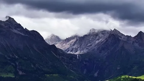 Dramatic Aerial View of Genyen Sacred Mountain Range Western Sichuan China Stock Footage 339256189
