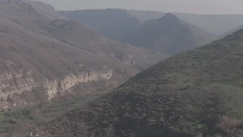 Dramatic Aerial View of the Golan Heights Canyons and Basalt Cliffs Stock Footage 325388371