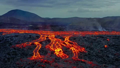 Dramatic aerial view of hot fiery lava rivers flowing from a volcanic eruption Stock Footage 343695928