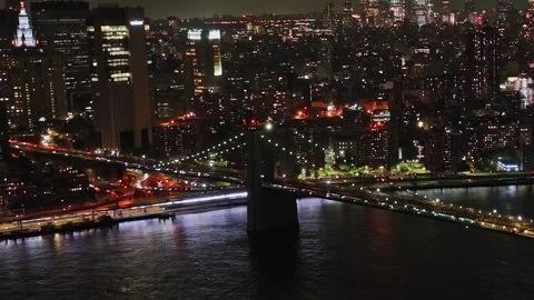 Dramatic aerial view of New York skyline at night with bright city lights Stock Footage 321361080