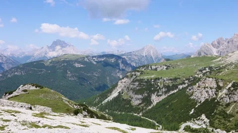 Dramatic Aerial View Over Majestic Mountain Peaks and Green Valleys Stock Footage 335140363