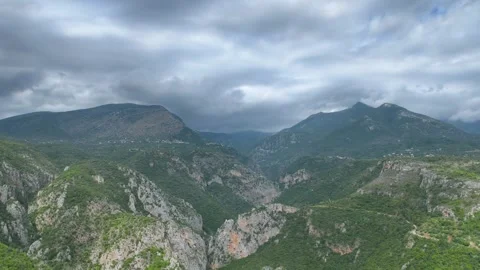 Dramatic Aerial View of Rocky Gorge and Storm Clouds in Mani Stock Footage 335645284
