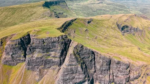 Dramatic aerial view of rugged cliffs in Scotland's countryside Stock Footage 314000799