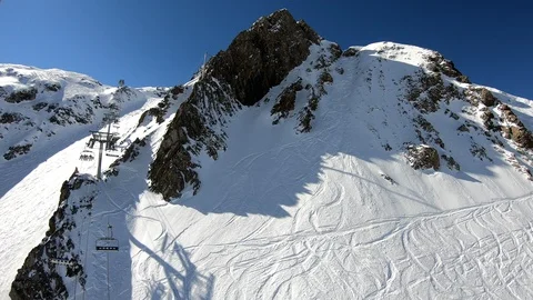 A dramatic aerial view of ski chair lift in the French Alps Stock Footage 105445269