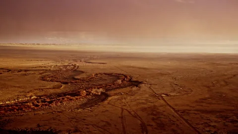 Dramatic aerial view of snow clouds overtaking the New Mexico plains landscape Stock Footage 333415407