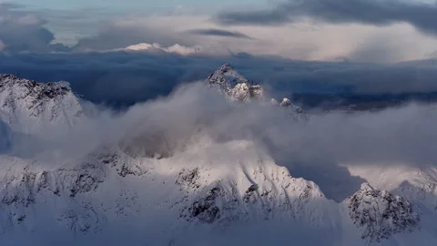 Dramatic aerial view of snowy mountain peaks, Norway Vídeo Stock 343936674