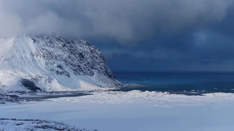 Dramatic aerial view of a snowy norwegian fjord 動画素材 342921274