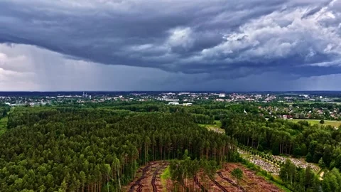Dramatic Aerial View: Storm Clouds Rolling Over City Forest Stock Footage 333691016