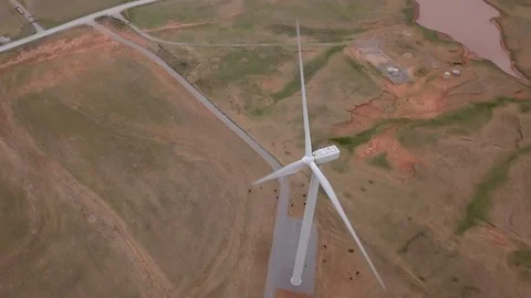 Dramatic aerial view of wind turbine generating electricity. Stock Footage 108865975