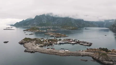 Dramatic aerial views of a coastal village in Norway's fjords Video stock 320265053