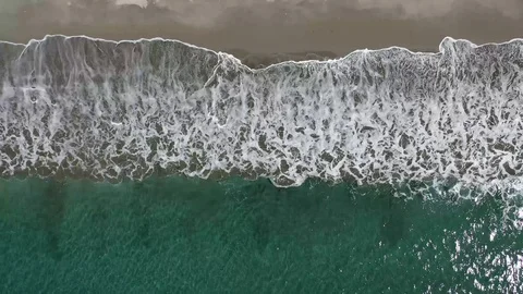 Dramatic Aerial Zoom Out of Ocean Waves Crashing on Tropical Beach in Costa Rica Stock Footage 100920188