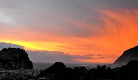 Dramatic African Sky Dramatic sky over rocks and ocean in the world famous... Stock Photos