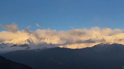 Dramatic Alpenglow and Flowing Clouds on Meili Mountain Range Stock-Footage 332182273