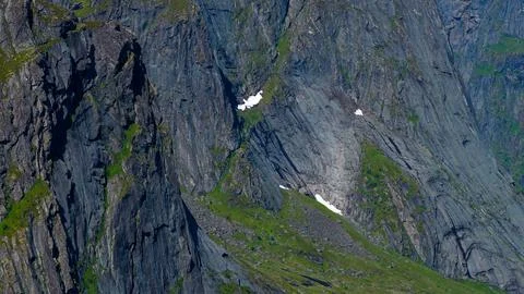 Dramatic Alpine Cliffs with Snow Patches in Lofoten Norway Stock Photos