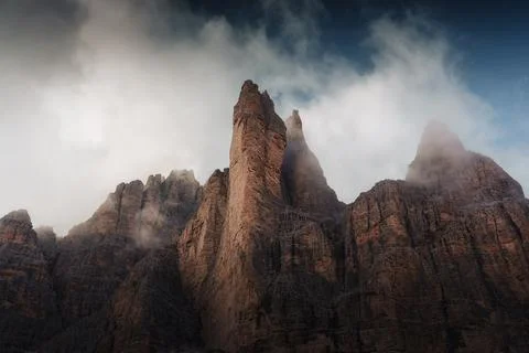 Dramatic Alpine Dolomites Peak Rising Through Storm Clouds Foggy at Italy Stock Photos