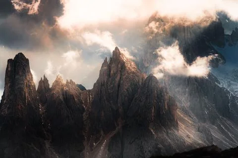 Dramatic Alpine Dolomites Peak Rising Through Storm Clouds Foggy at Italy Stock Photos