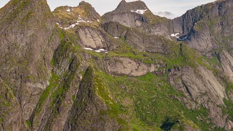 Dramatic Alpine Mountain Peaks and Moss-Covered Cliffs in Lofoten Norway Fotos Stock