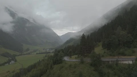 Dramatic Alpine Mountains Shrouded in Clouds - Breathtaking Aerial Footage Stock Footage 280307283