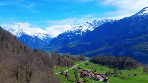 Dramatic Alpine Valley Panorama with Snow-Capped Peaks, Brienz 4K Stock Footage 341279779