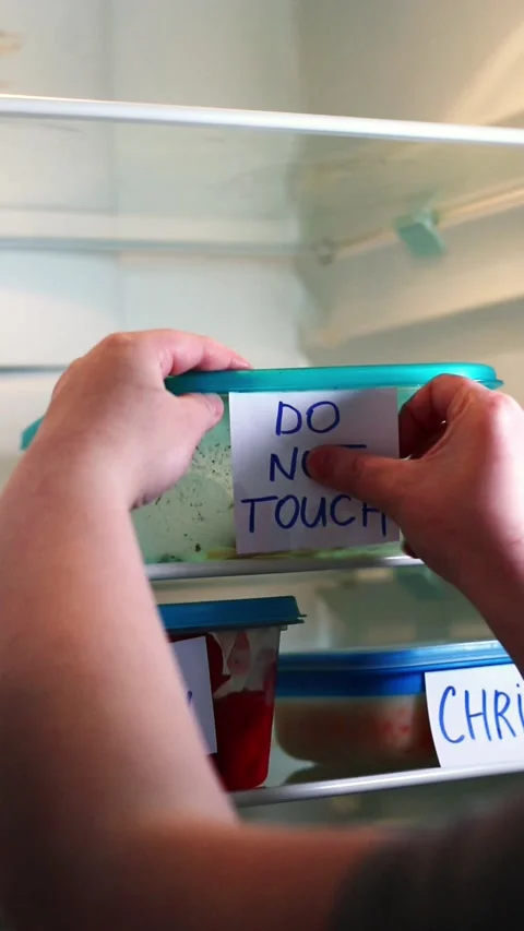 Dramatic and angry labels on meal prep containers in work fridge Stock Footage 314433204