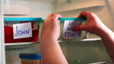 Dramatic and angry labels on meal prep containers in work fridge Stock Footage 314433206