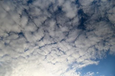 Dramatic and Beautiful Cloud Patterns Majestically Displayed Under a Clear Blue Stock Photos