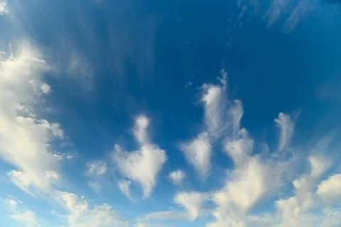 Dramatic and Beautiful Cloud Patterns Forming Against a Clear and Bright Blue Sk Stock Photos