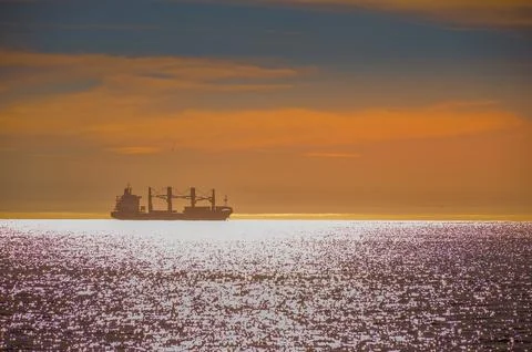 Dramatic and beautiful Ocean sunset with a ship in Atlantic Stock Photos